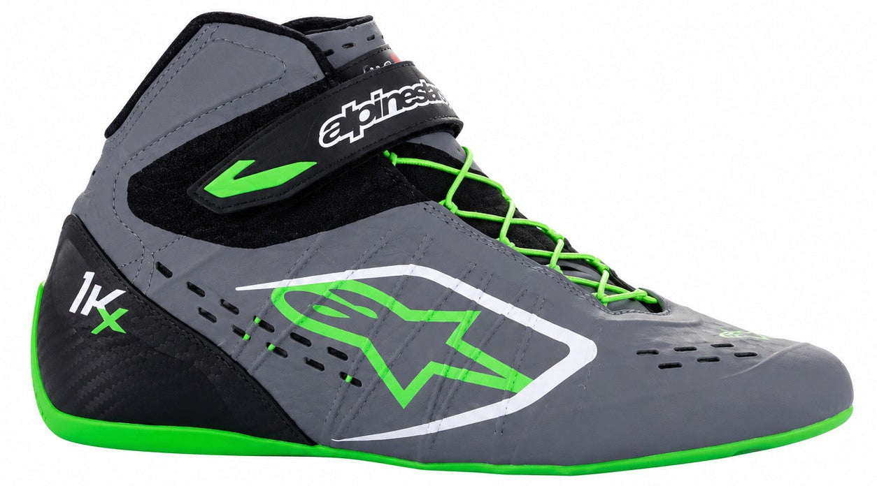 A high-top Alpinestars racing boot in gray and black with bright neon green accents, laces, and trim, shown from a side profile on a white background.